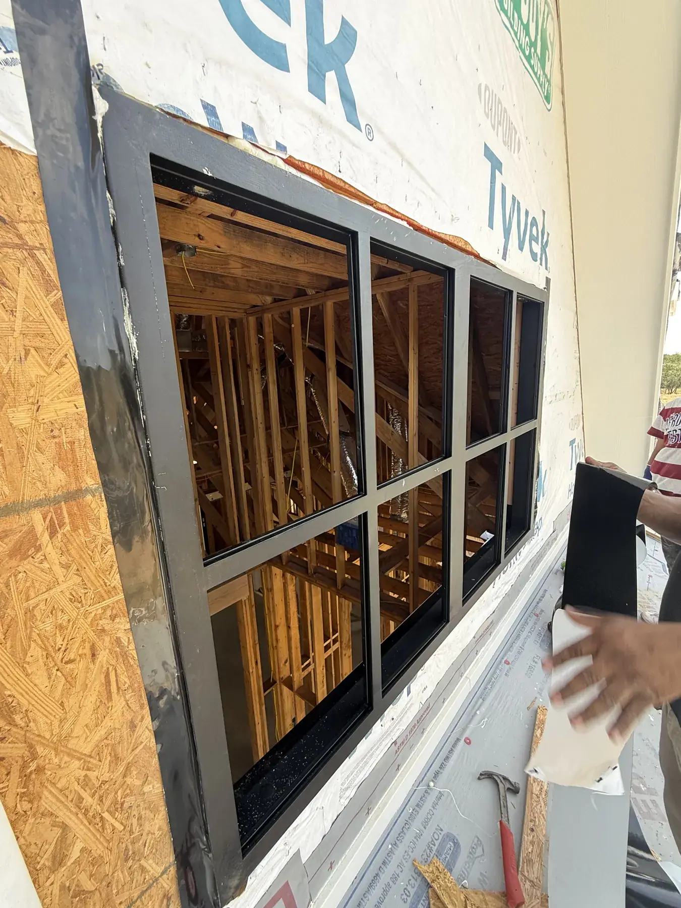 Black window installed in a new construction wall