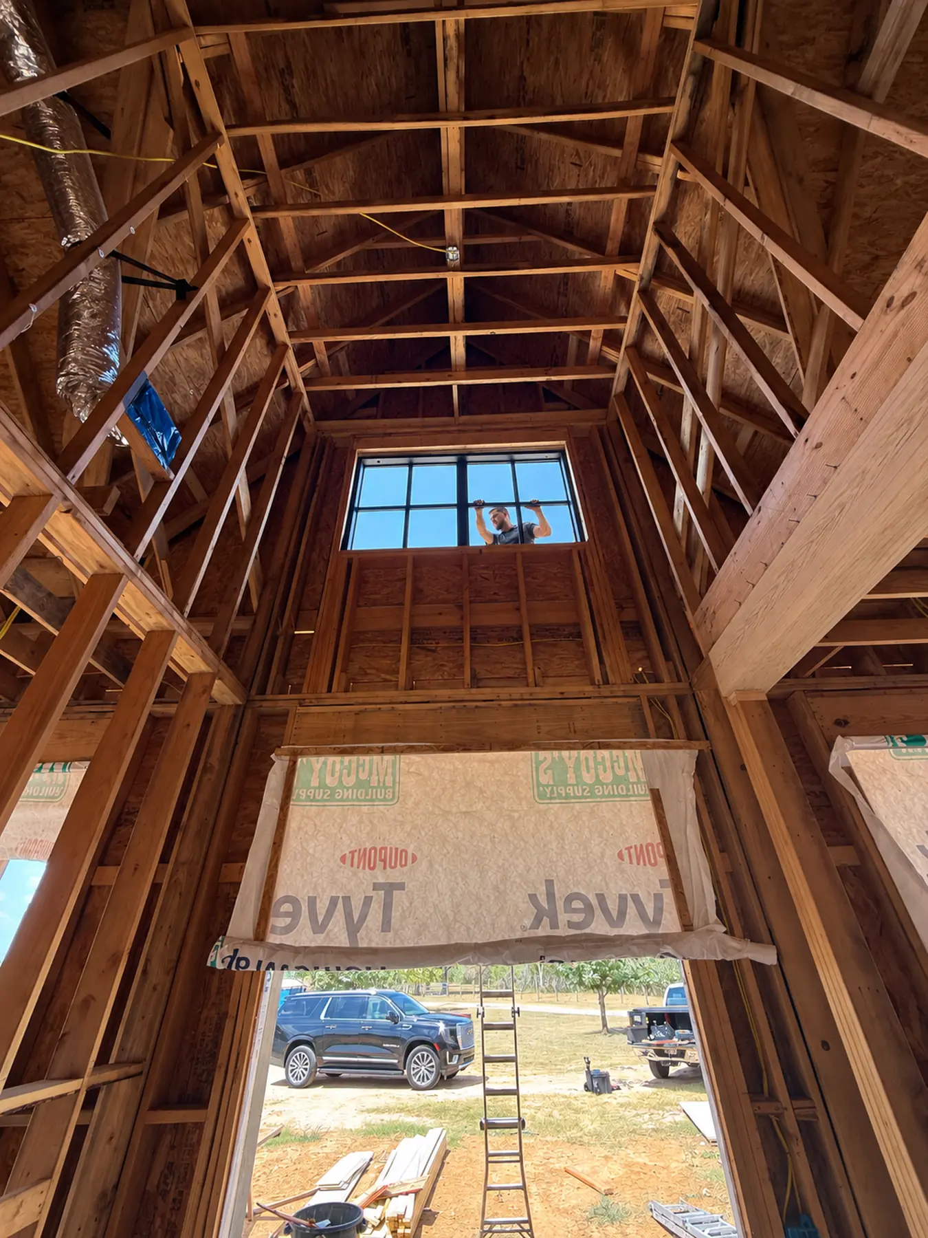 Tall window opening framed in a new home