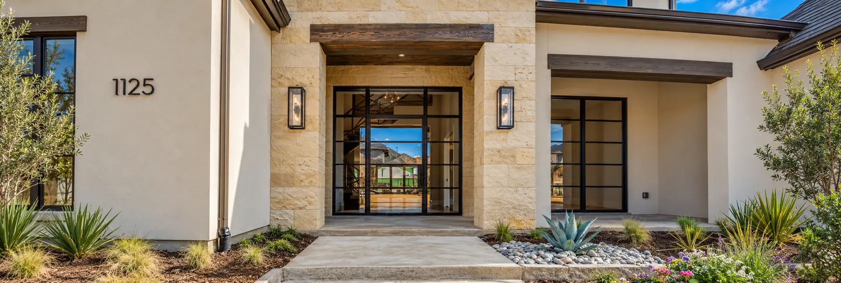 Black iron double entry door on a Texas home