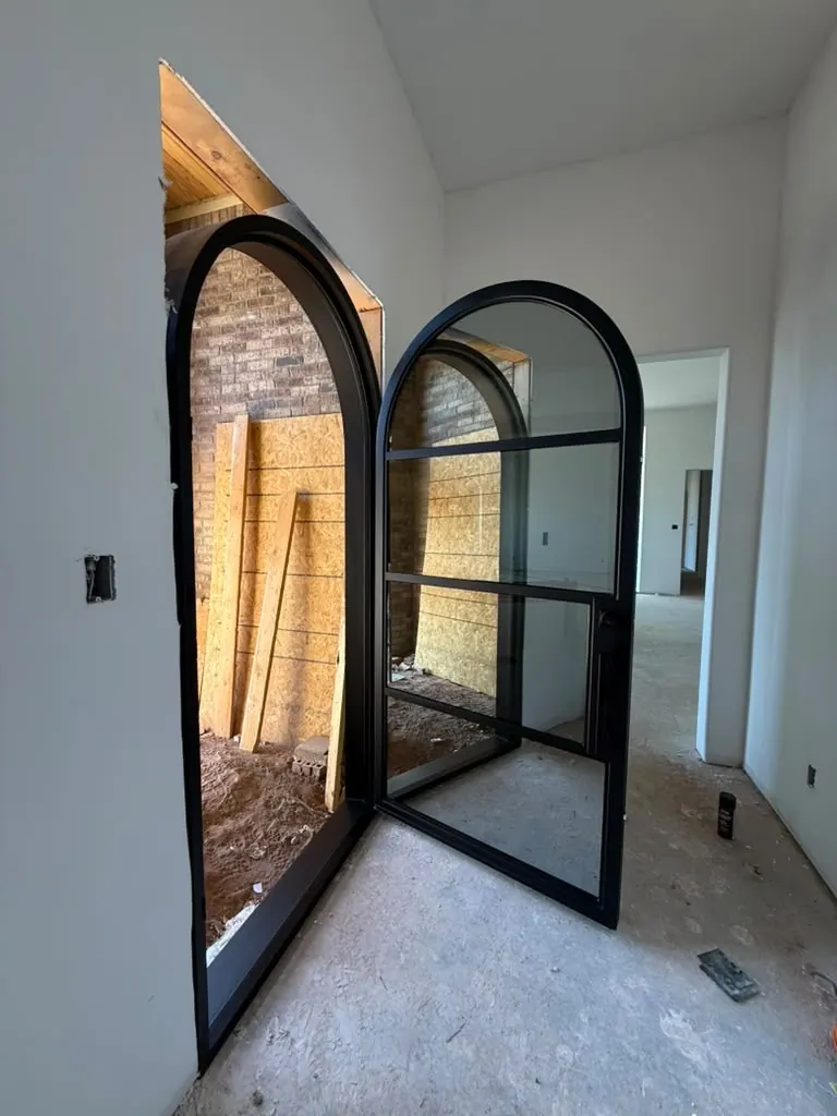 Arched double doors by Blackline Premium Solutions