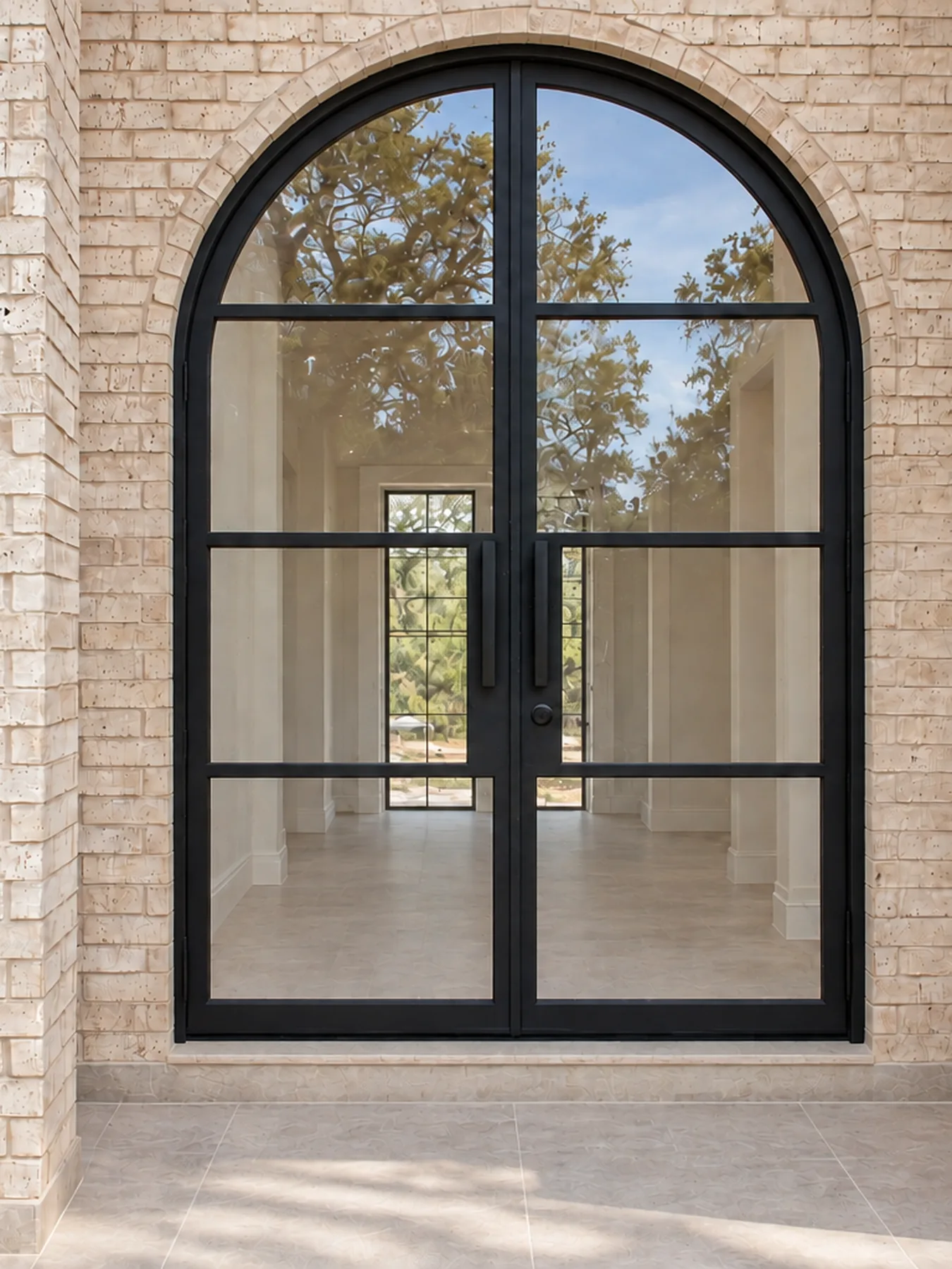 Arched steel double doors by Blackline Premium Solutions